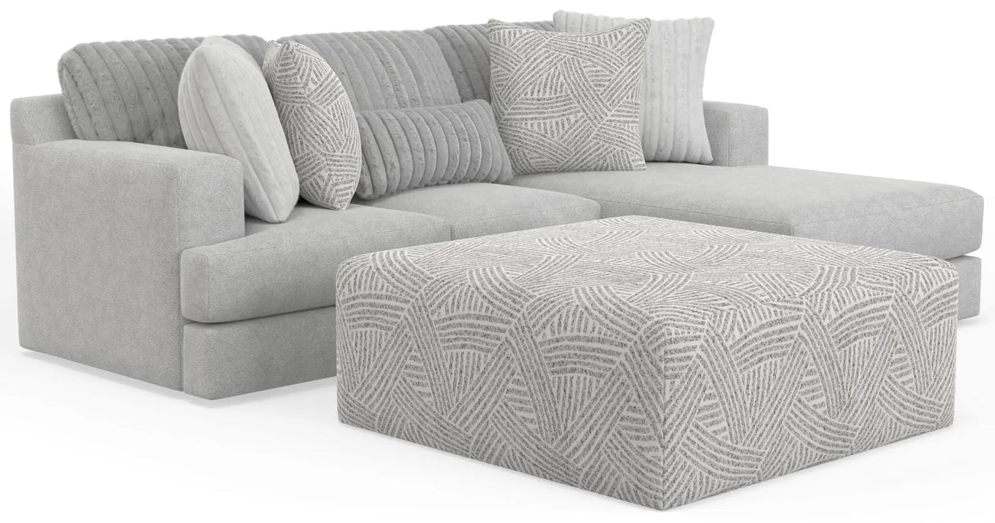 Logan - Upholstered Sectional With Comfort Coil Seating - 46" Cocktail Ottoman And Accent Pillows Included by Unique Piece Furniture