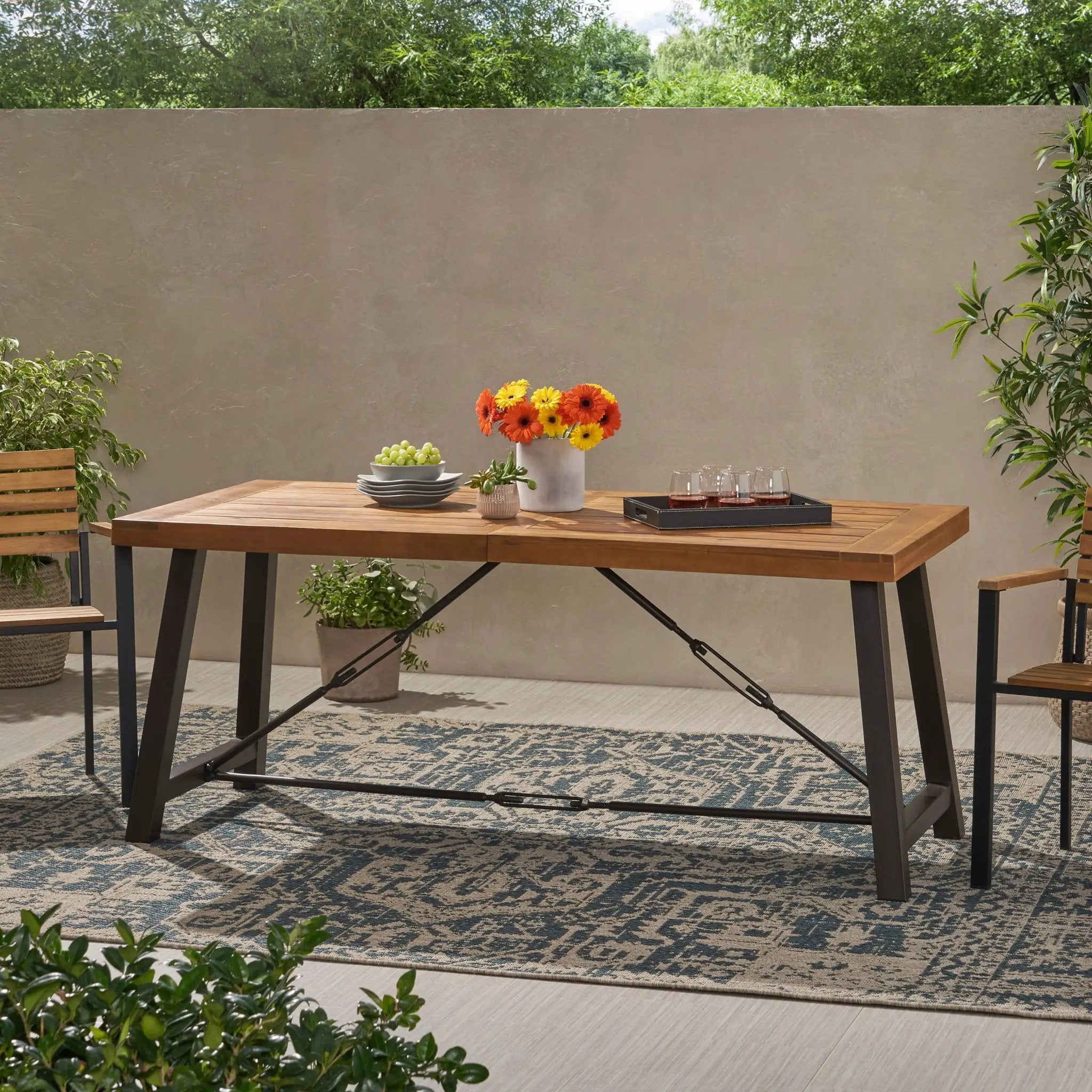 Outdoor Dining Table With Slat Wooden Panel And Turnbuckle Accents - Teak by HouseOfZazla