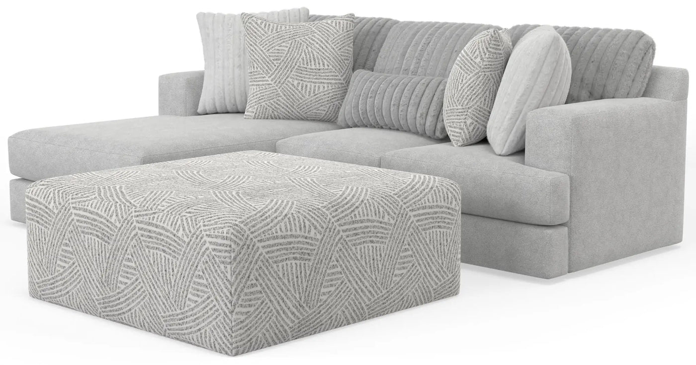 Logan - Upholstered Sectional With Comfort Coil Seating - 46" Cocktail Ottoman And Accent Pillows Included by Unique Piece Furniture