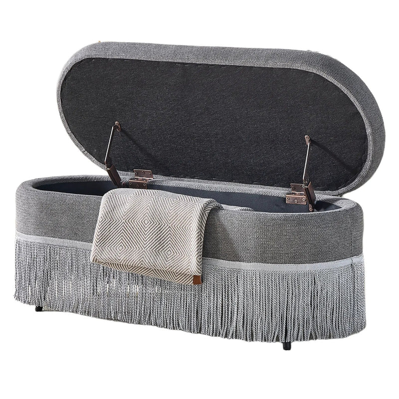 Oval Upholstered Storage Ottoman with Fringe Trim by HouseOfZazla