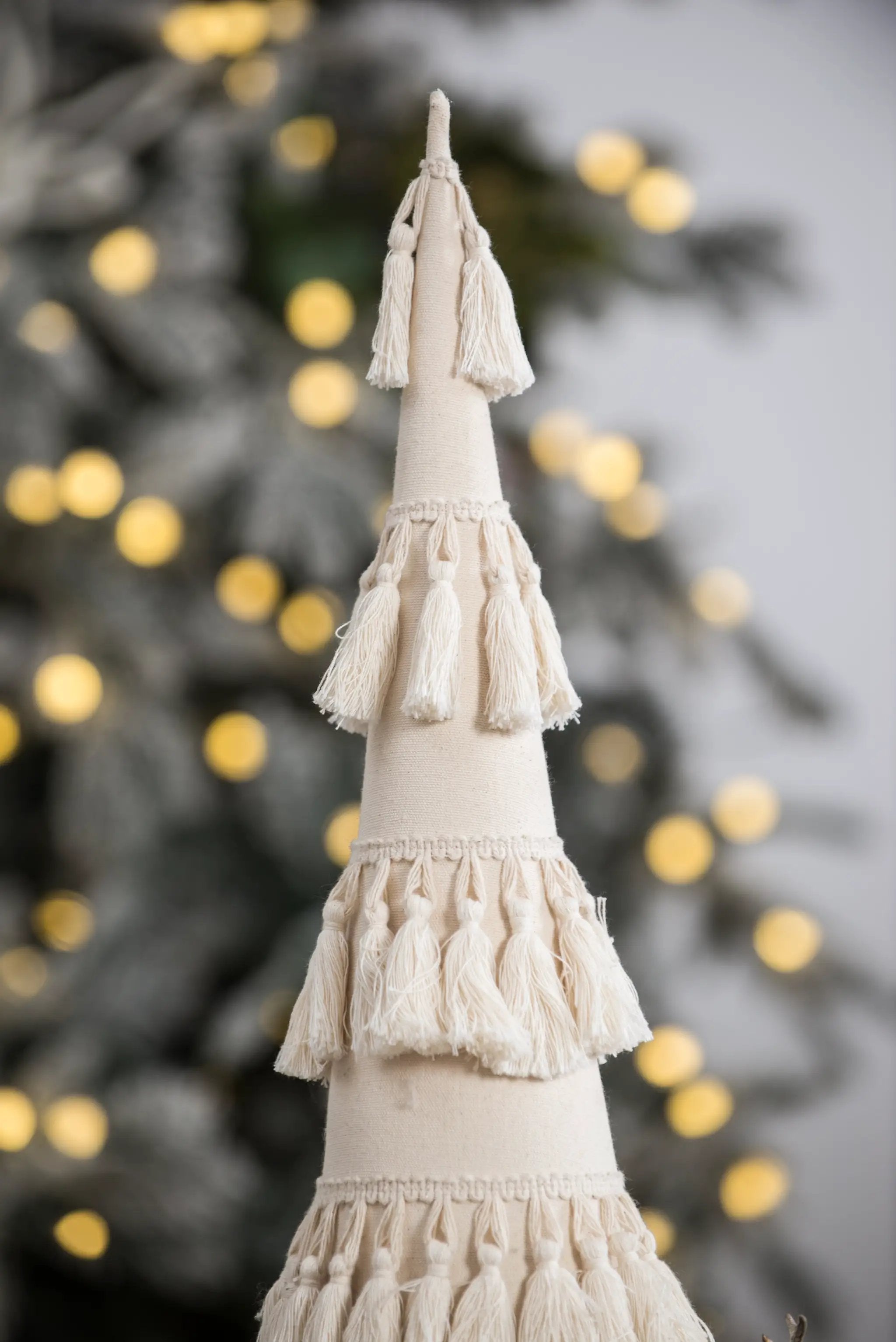 Fringes Embellished Cone With Wooden Base by HouseOfZazla