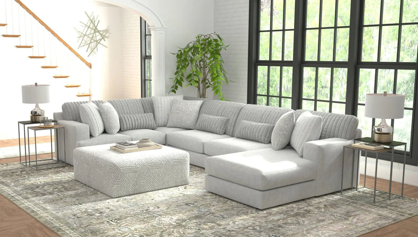 Logan - Upholstered Sectional With Comfort Coil Seating - 46" Cocktail Ottoman And Accent Pillows Included by Unique Piece Furniture