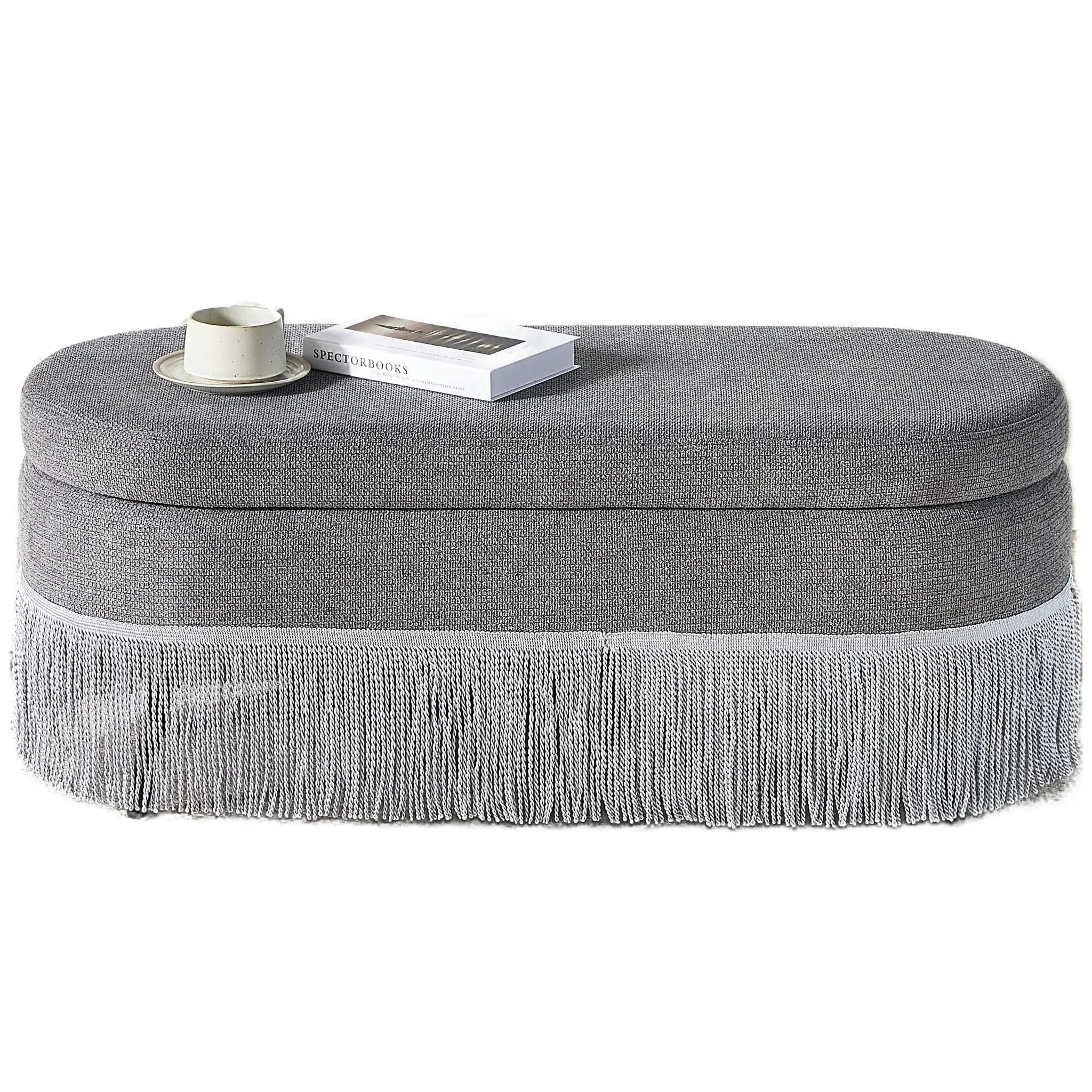 Oval Upholstered Storage Ottoman with Fringe Trim by HouseOfZazla