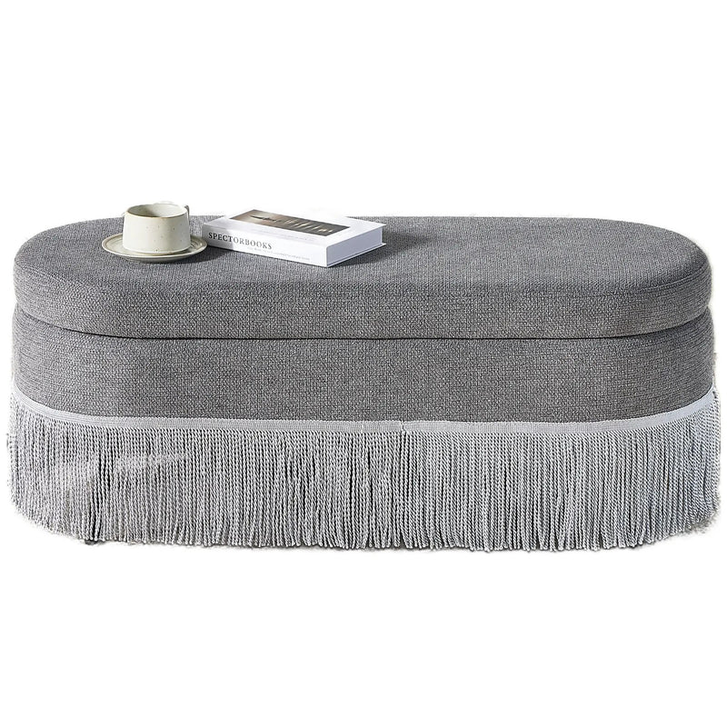 Oval Upholstered Storage Ottoman with Fringe Trim by HouseOfZazla