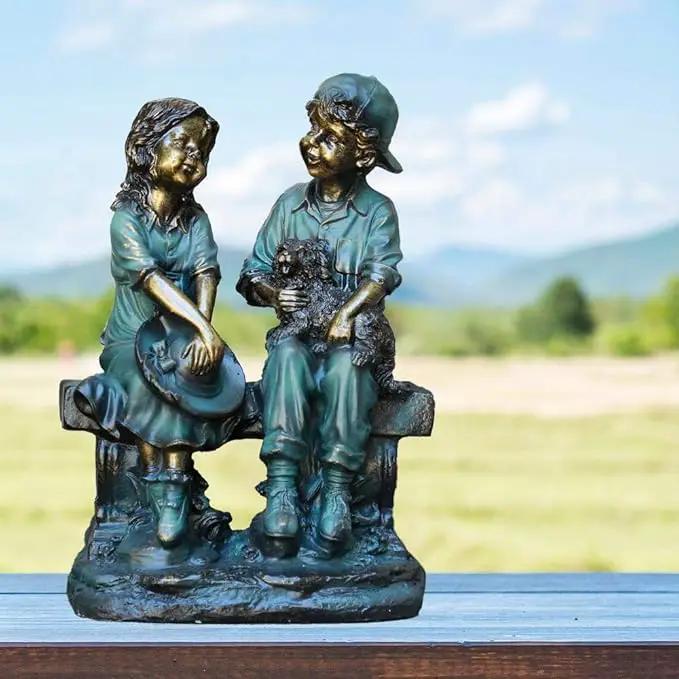 Alpine Corporation 16" Tall Indoor/Outdoor Girl and Boy Sitting on Bench with Puppy Statue Yard Art Decoration by GreenHaven Gardens