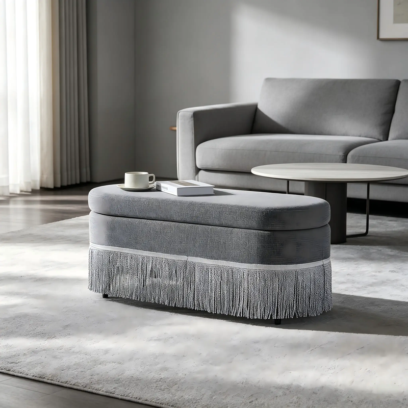 Oval Upholstered Storage Ottoman with Fringe Trim by HouseOfZazla