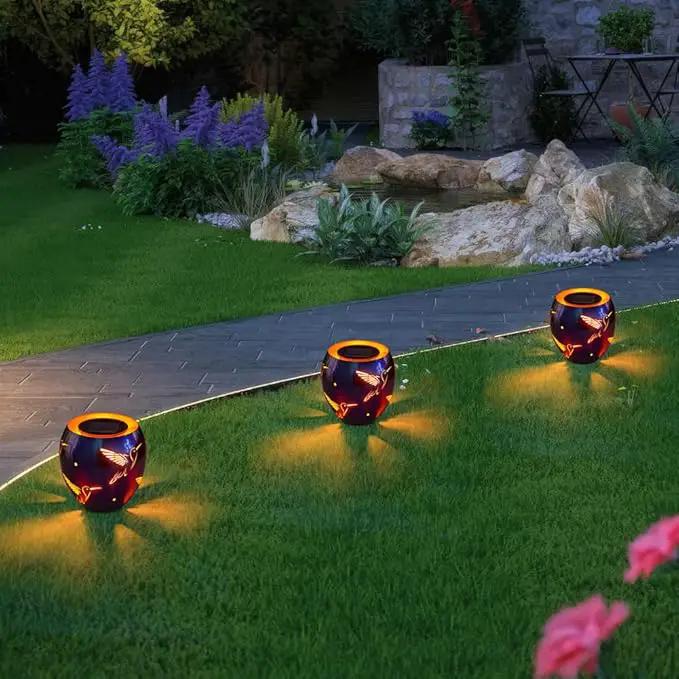 VEWOGARDEN Solar Lanterns Outdoor Waterproof Hummingbird Hollowed-Out Metal Lantern Solar Lights with Flickering Flame for Patio Porch Table, Purple by GreenHaven Gardens