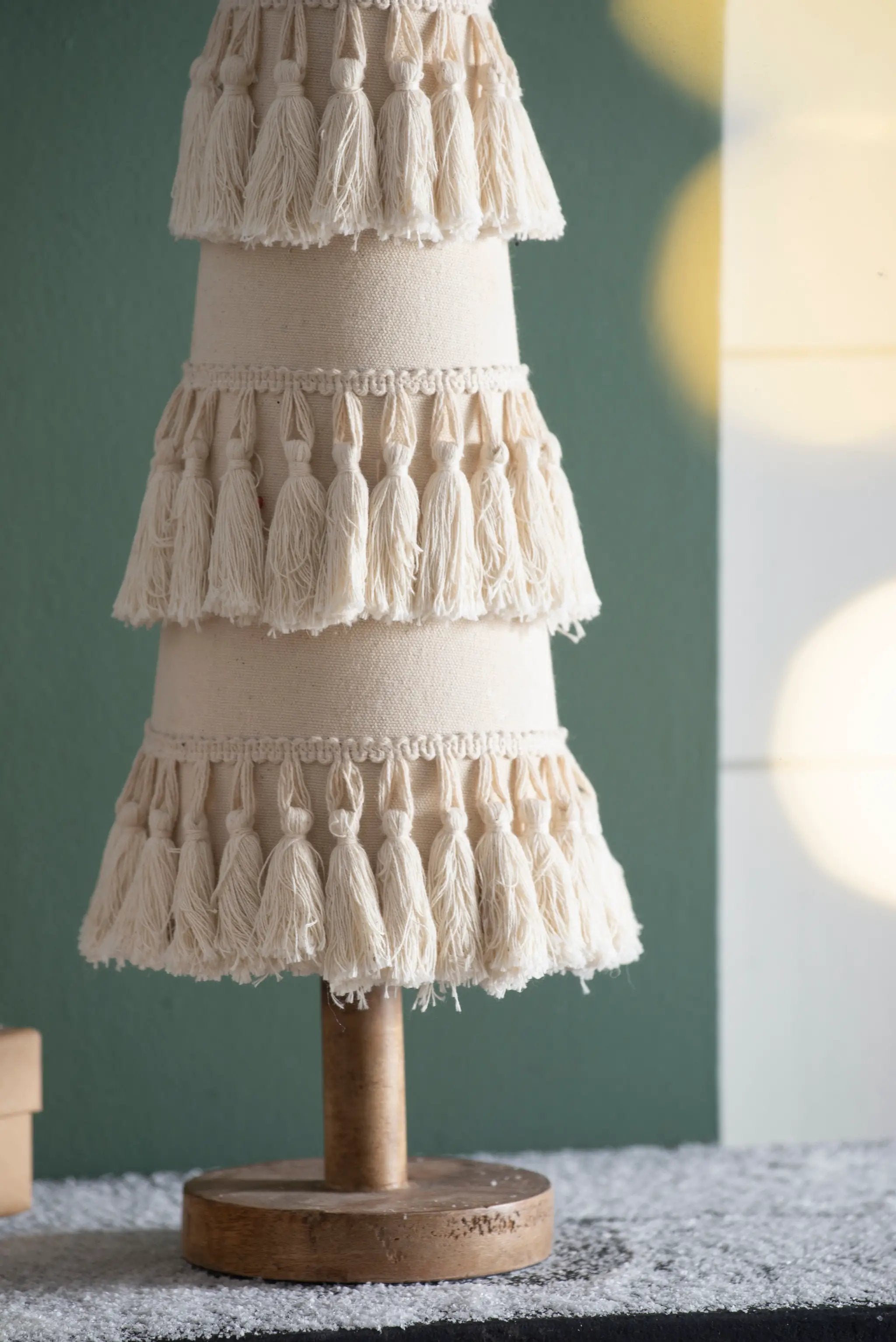 Fringes Embellished Cone With Wooden Base by HouseOfZazla