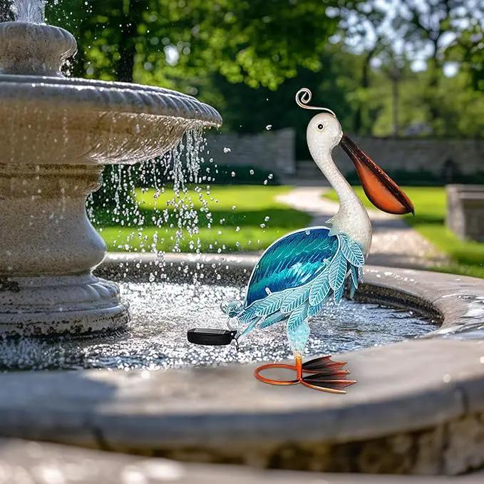 HONGLAND Solar Metal Pelican Statues Garden Sculpture & Statues, 19 Inch Glass Outdoor Pelican Yard Art Coastal Ocean Bird Decor Lawn Ornament for Backyard Porch Patio Decor（Blue） by GreenHaven Gardens