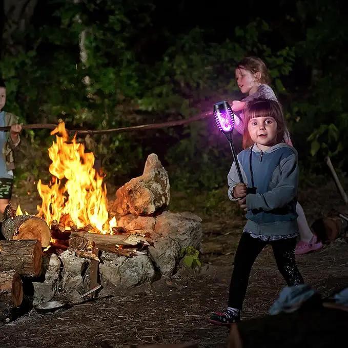 Toodour Solar Torch Flame Lights, 12 Pack Outdoor Flickering Flame Waterproof Pathway Lights Landscape Decoration for Garden, Lawn, Yard - Purple by GreenHaven Gardens