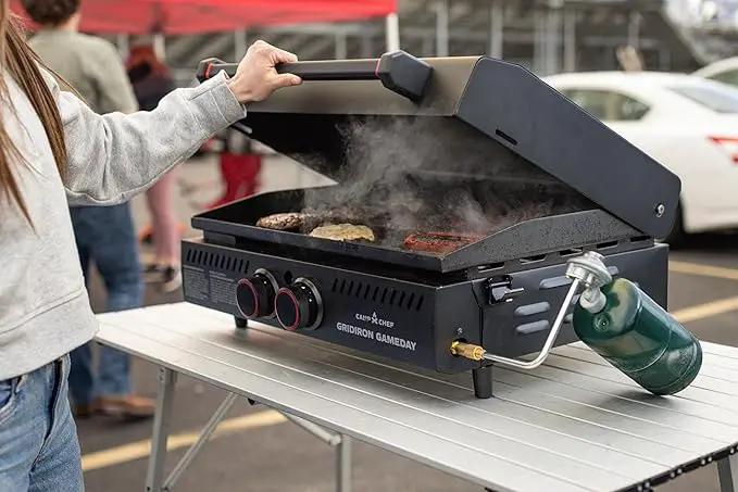 Gridiron Gameday 24" Flat Top Grill – Portable Tabletop Griddle with Hinged Lid, 24,000 BTUs, Flamethrower Ignition, Dual Heat Zones & Adjustable Legs for Tailgating, Camping, Outdoor Cooking by GreenHaven Gardens