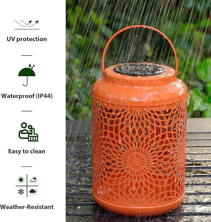 Glitzhome Solar Lantern Orange Metal Cutout Scrollwork Outdoor Hanging Solar Light with Handle for Garden Patio Yard Outdoor Decor by GreenHaven Gardens