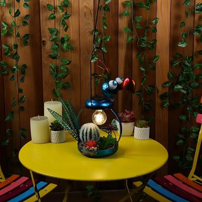 Alpine Corporation LYT290SLR-HH Solar-Powered Metal Flamingo with Garden Enclosed LED Light, Solar Patio Decor, 16''H, Blue by GreenHaven Gardens