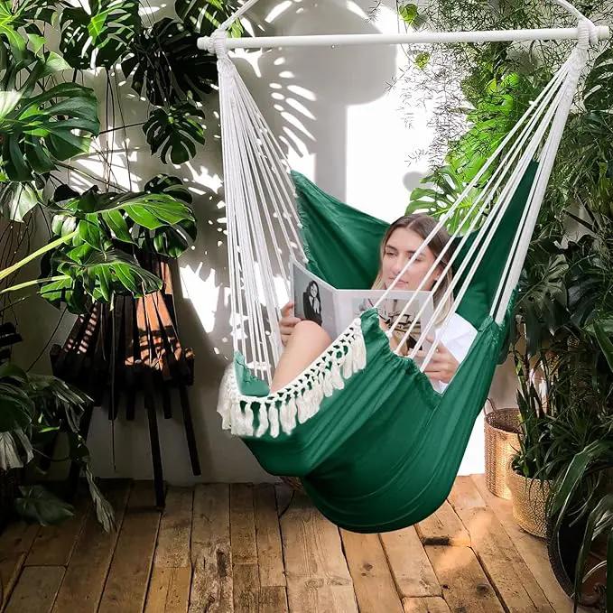 Chihee Hammock Chair Hanging Chair with Foot Rest 2 Cushions Max 500lbs Robust Metal Spreader Bar Collapsible Easy Storage Soft Cotton Swing Chair Strong Strap Iron Carabiner Side Pocket Included by GreenHaven Gardens