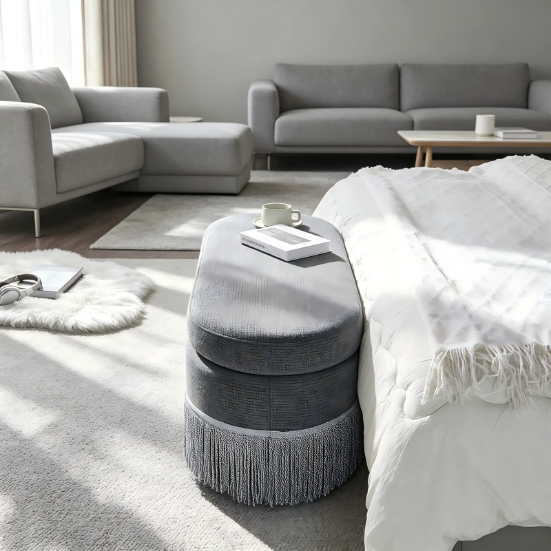 Oval Upholstered Storage Ottoman with Fringe Trim by HouseOfZazla