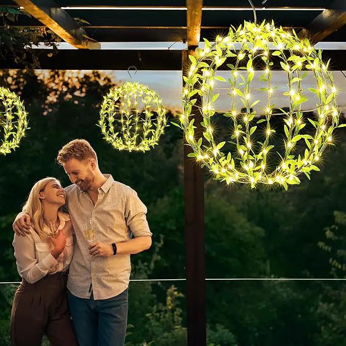 Joomer Solar Hanging Lights Outdoor, 2 Pack 12in 120 LED Solar Globe Lights, 8 Modes Waterproof Foldable Metal Sphere Light with Hook for Garden Yard Porch Decor-Warm White (Ball with Green Leaf) by GreenHaven Gardens