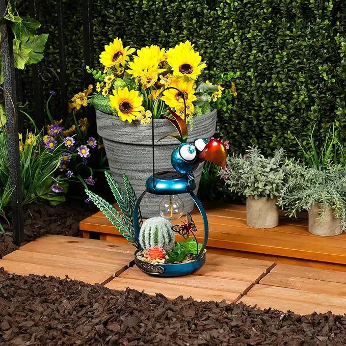 Alpine Corporation LYT290SLR-HH Solar-Powered Metal Flamingo with Garden Enclosed LED Light, Solar Patio Decor, 16''H, Blue by GreenHaven Gardens