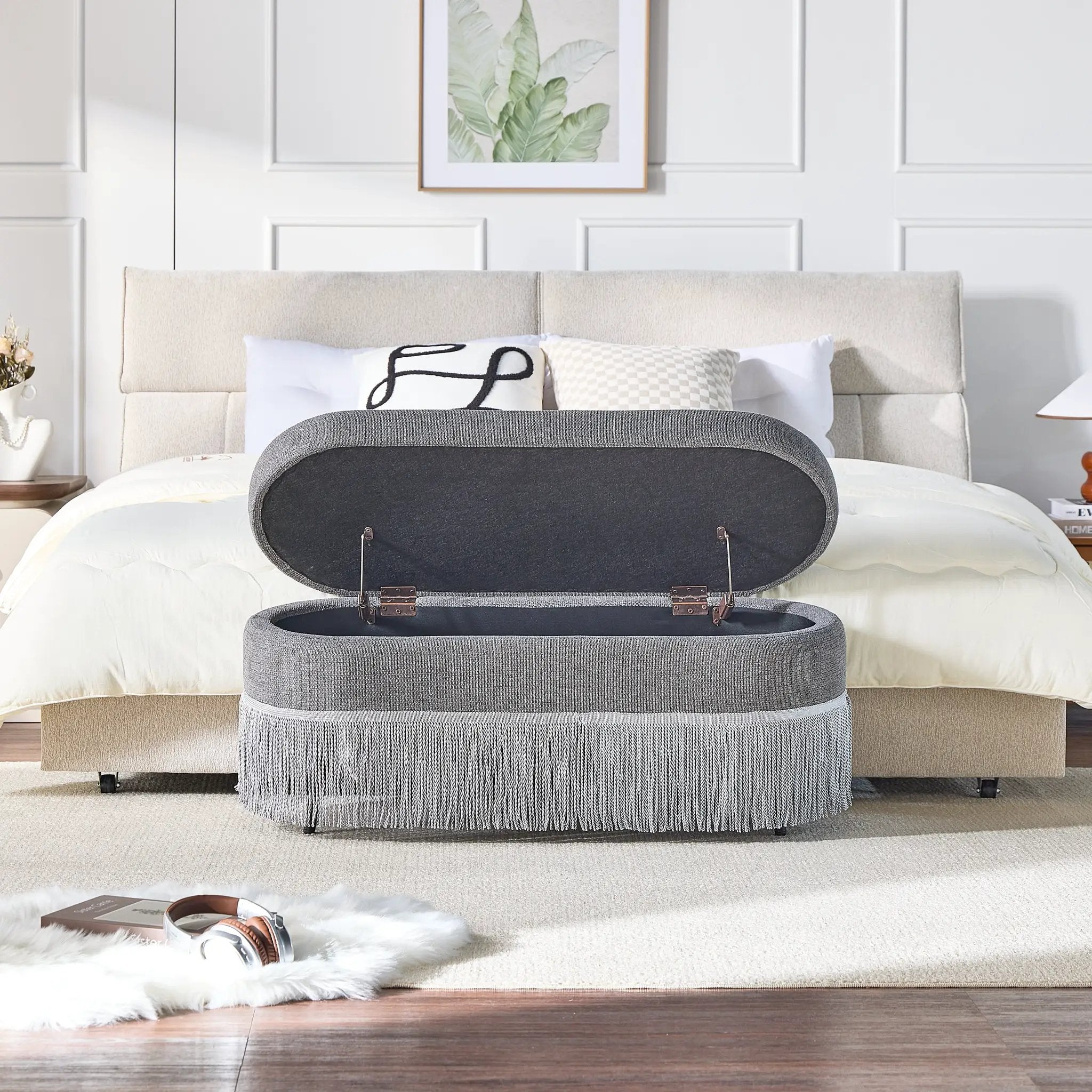 Oval Upholstered Storage Ottoman with Fringe Trim by HouseOfZazla