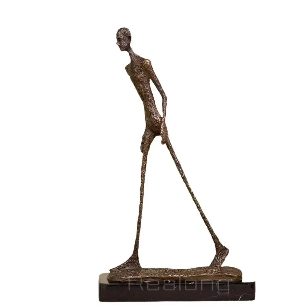 Abstract Walking Man Sculpture Modern Textured Metal Figurine by House Of Avana