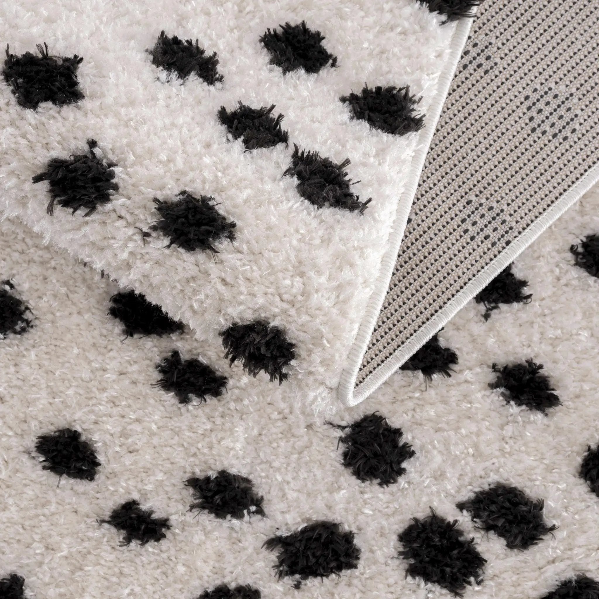 Cansu Black & White Dotted Area Rug by Hauteloom
