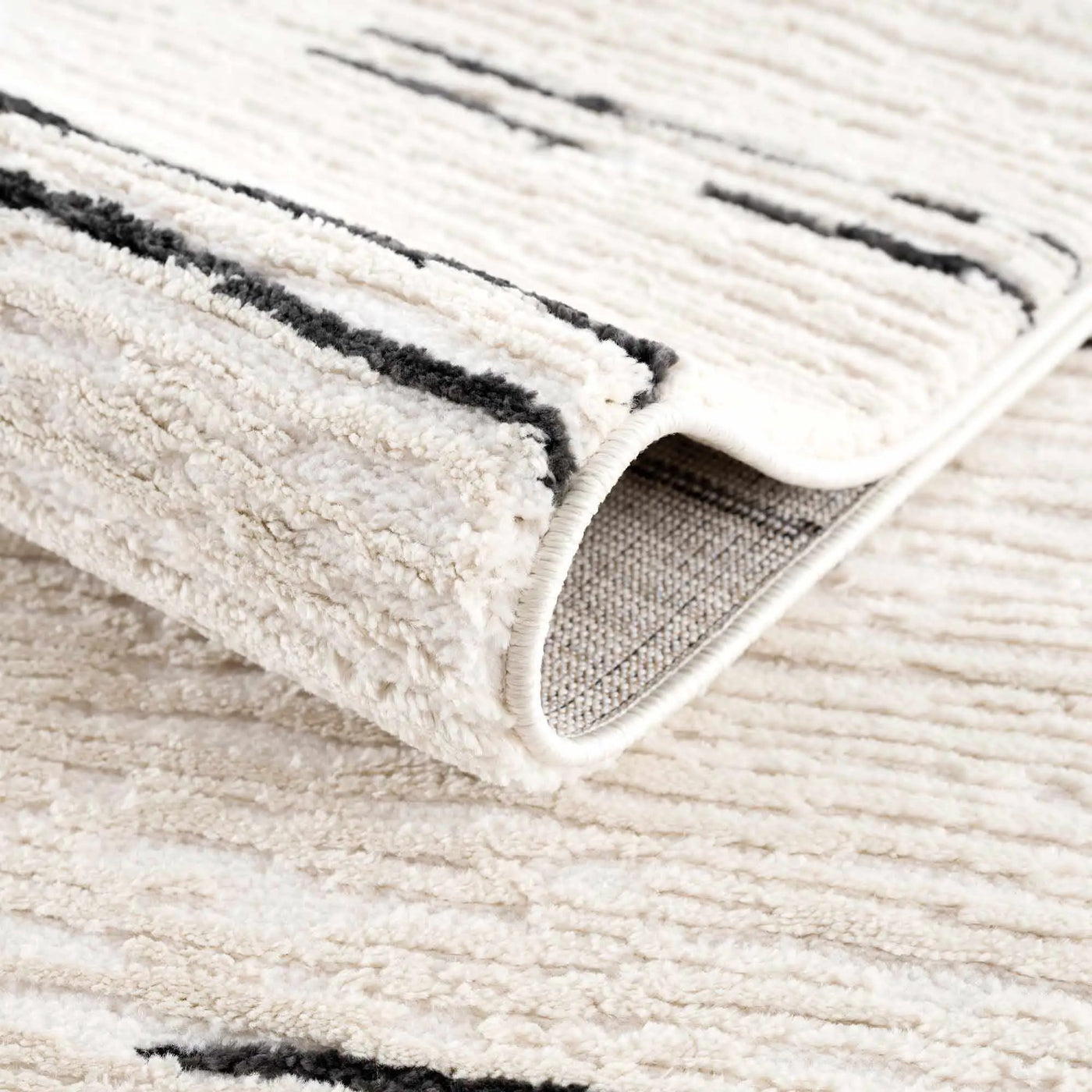 Riad Black Striped White Rug with Tassels by Boutique Rugs