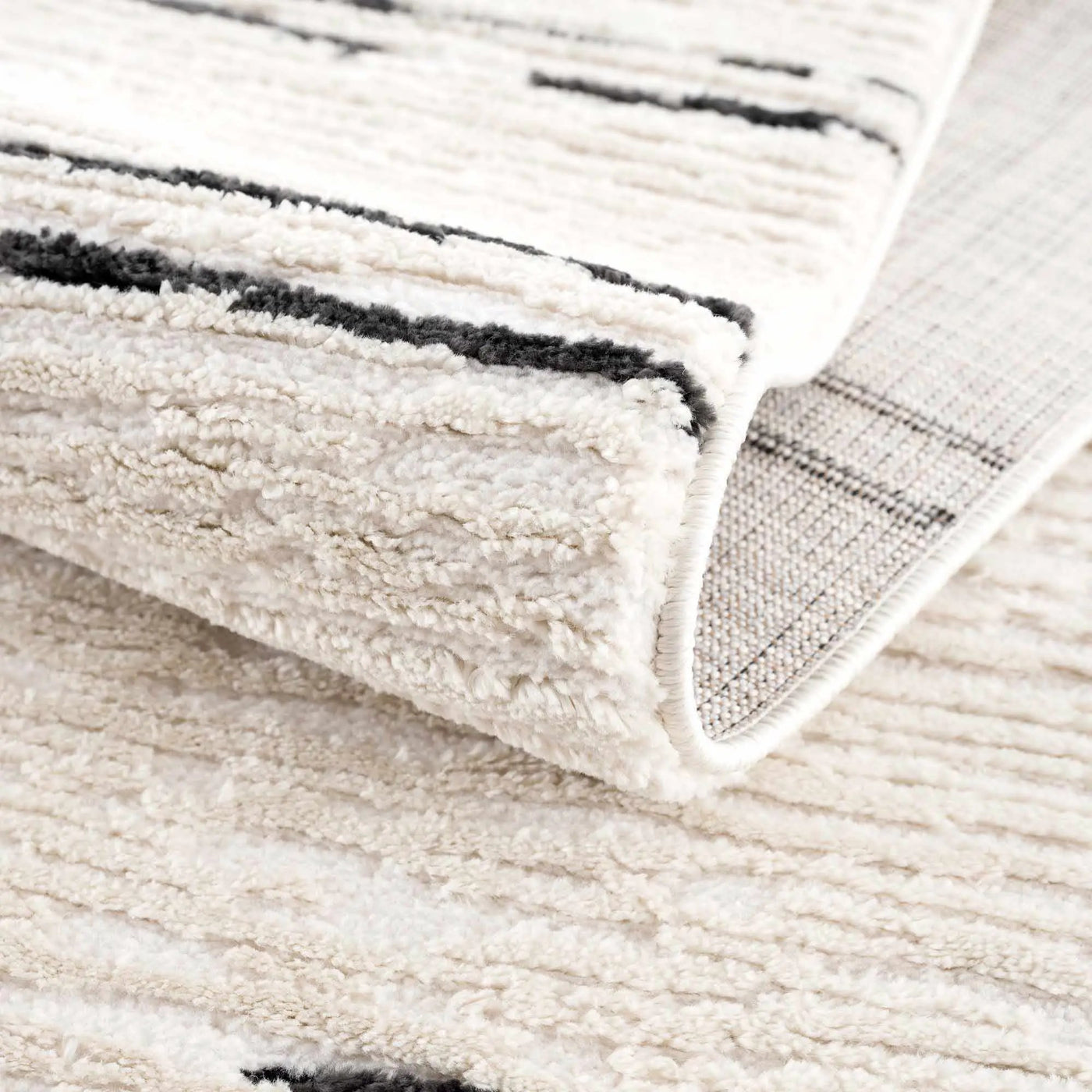 Riad Black Striped White Rug with Tassels by Boutique Rugs