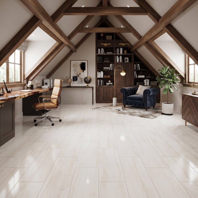 Light-colored rectangular floor tiles in a modern, spacious attic home office with exposed wooden beams, a desk, office chair, bookshelves, blue armchair, and potted plant.