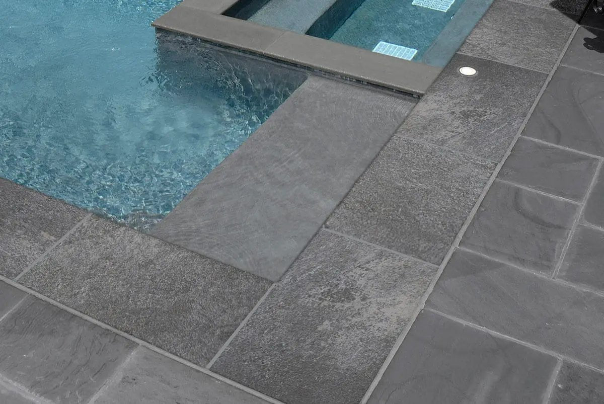 Quarzo Gray Matte Travertine Look Porcelain Pavers 24x24 in a finished room