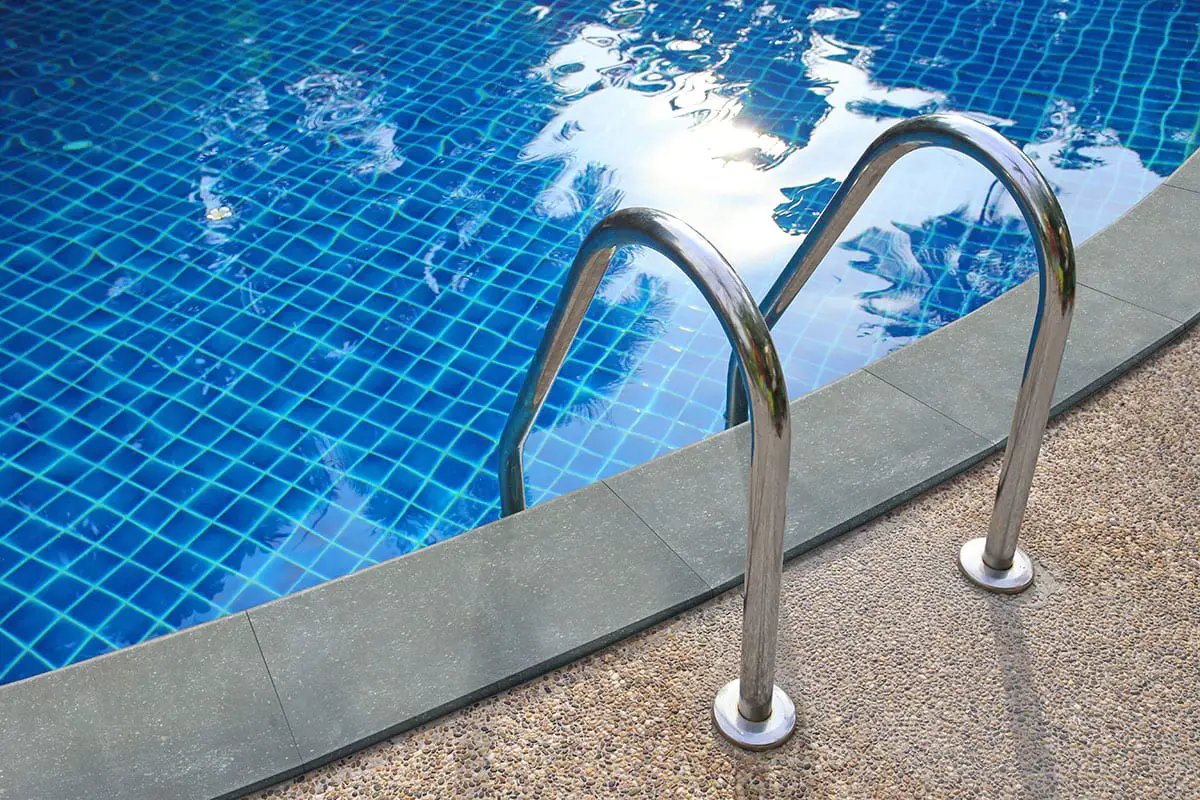 Vulkon Nero Matte Limestone Look Porcelain Pool Copings 13x24 in a finished room