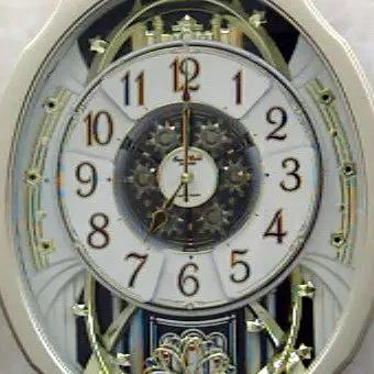 Moving Face Pendulum Wall Clock - Plays Melodies Every Hour by HomePacific
