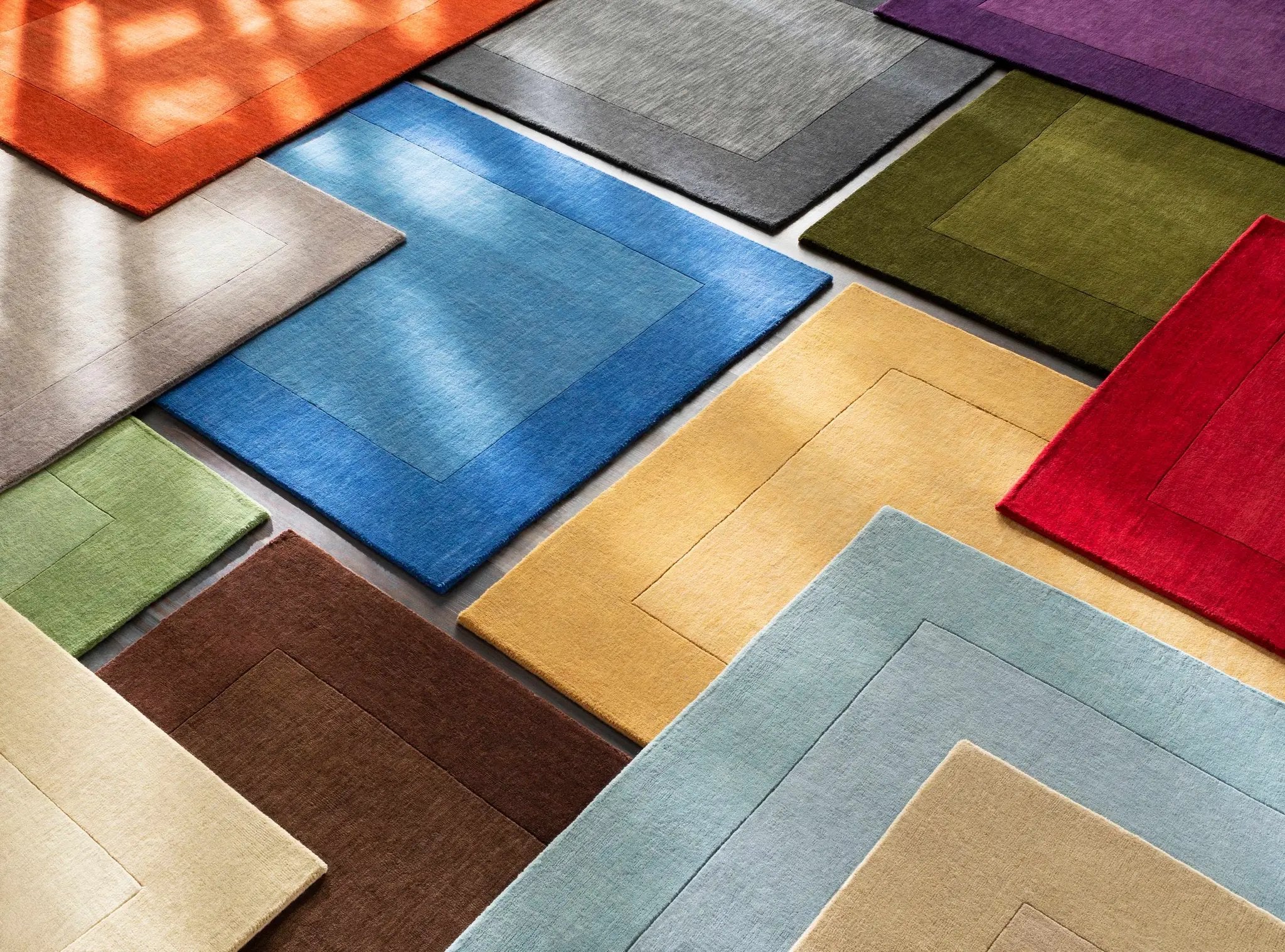 Arkabutla Solid Blue Bordered Wool Rug by Boutique Rugs