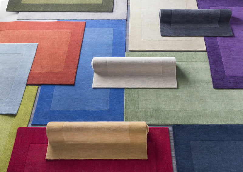 Arkabutla Solid Blue Bordered Wool Rug by Boutique Rugs