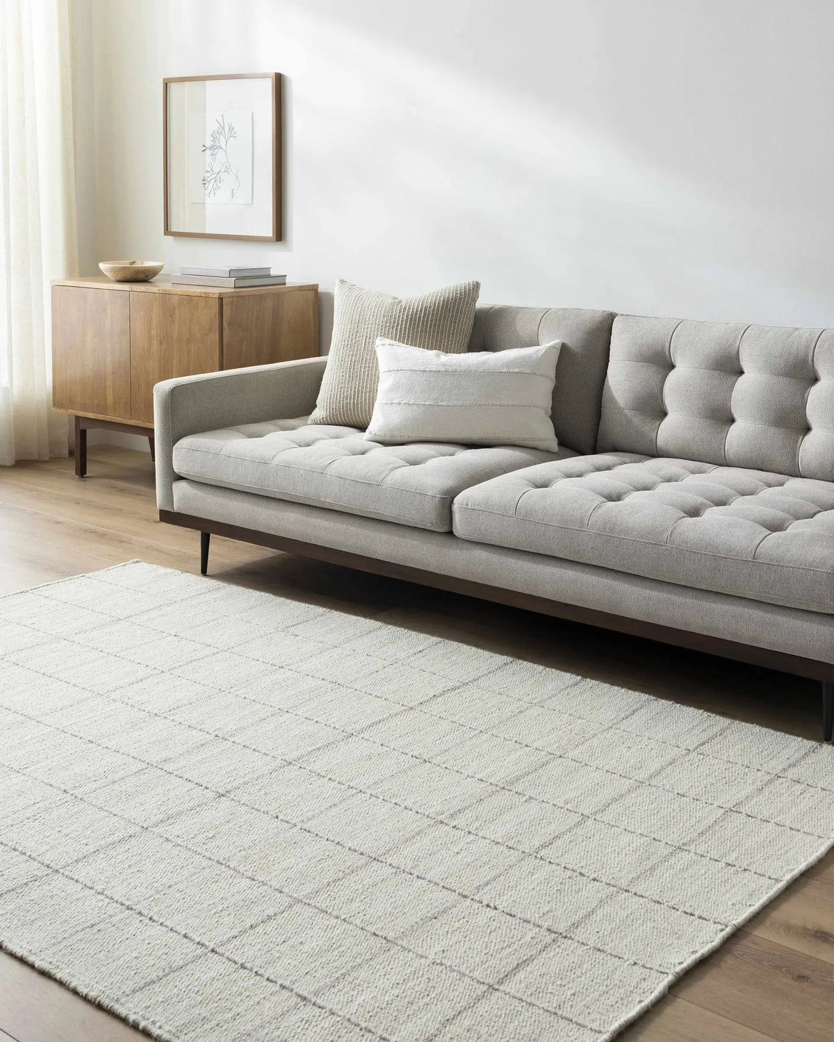 Nissa Cream Checkered Wool Rug, installed in a room