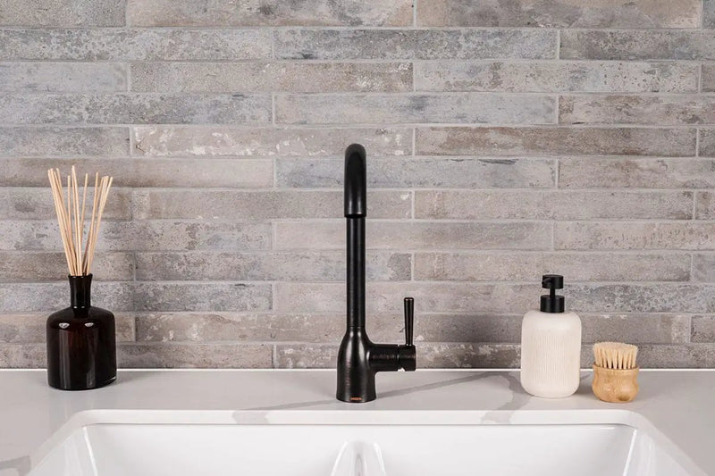 Brickstone Taupe Brick 2x18 Matte Porcelain Mosaics in a finished room
