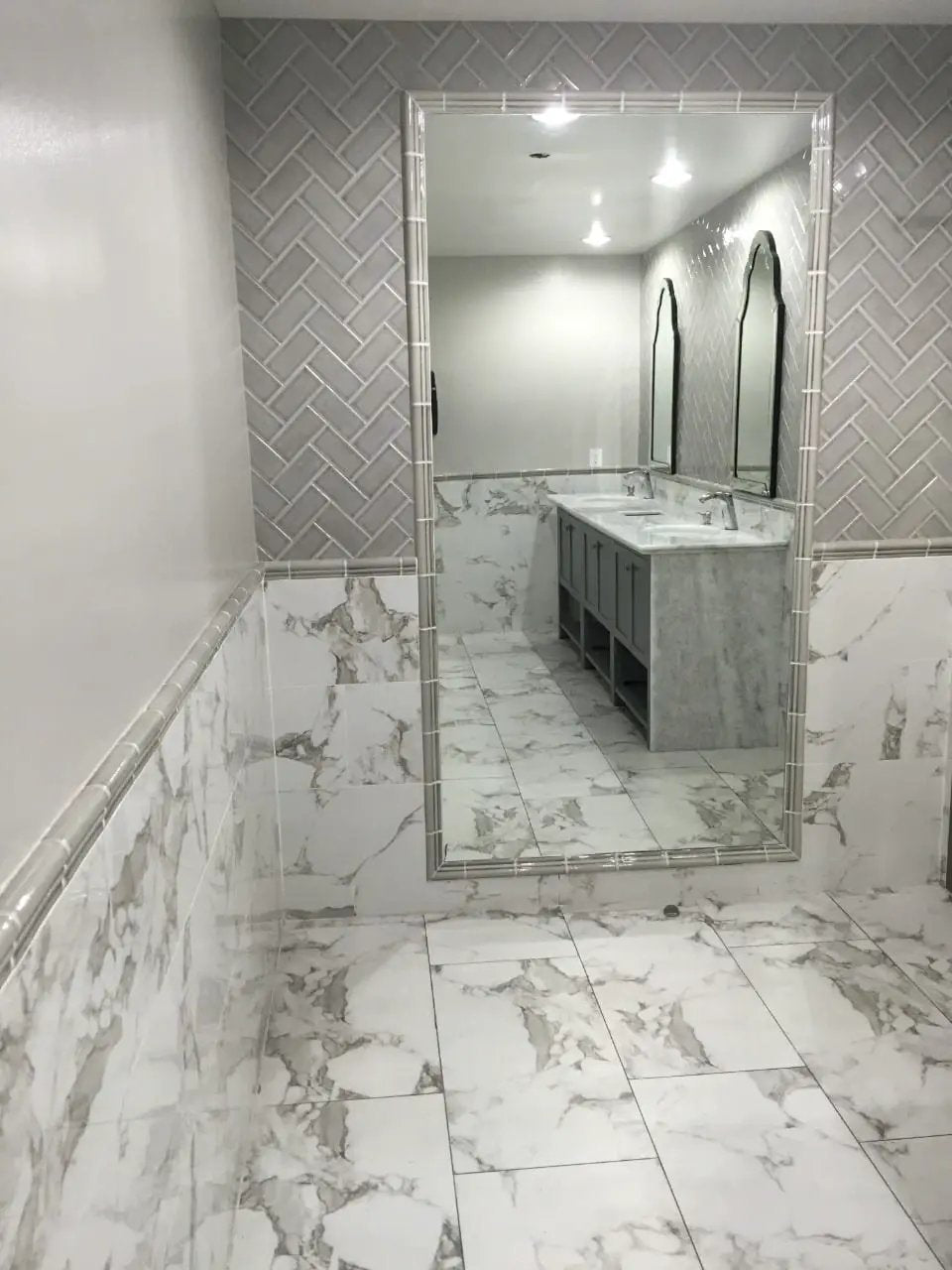 Pietra Statuario Polished Marble Look Porcelain Tiles 12x24 in a finished room