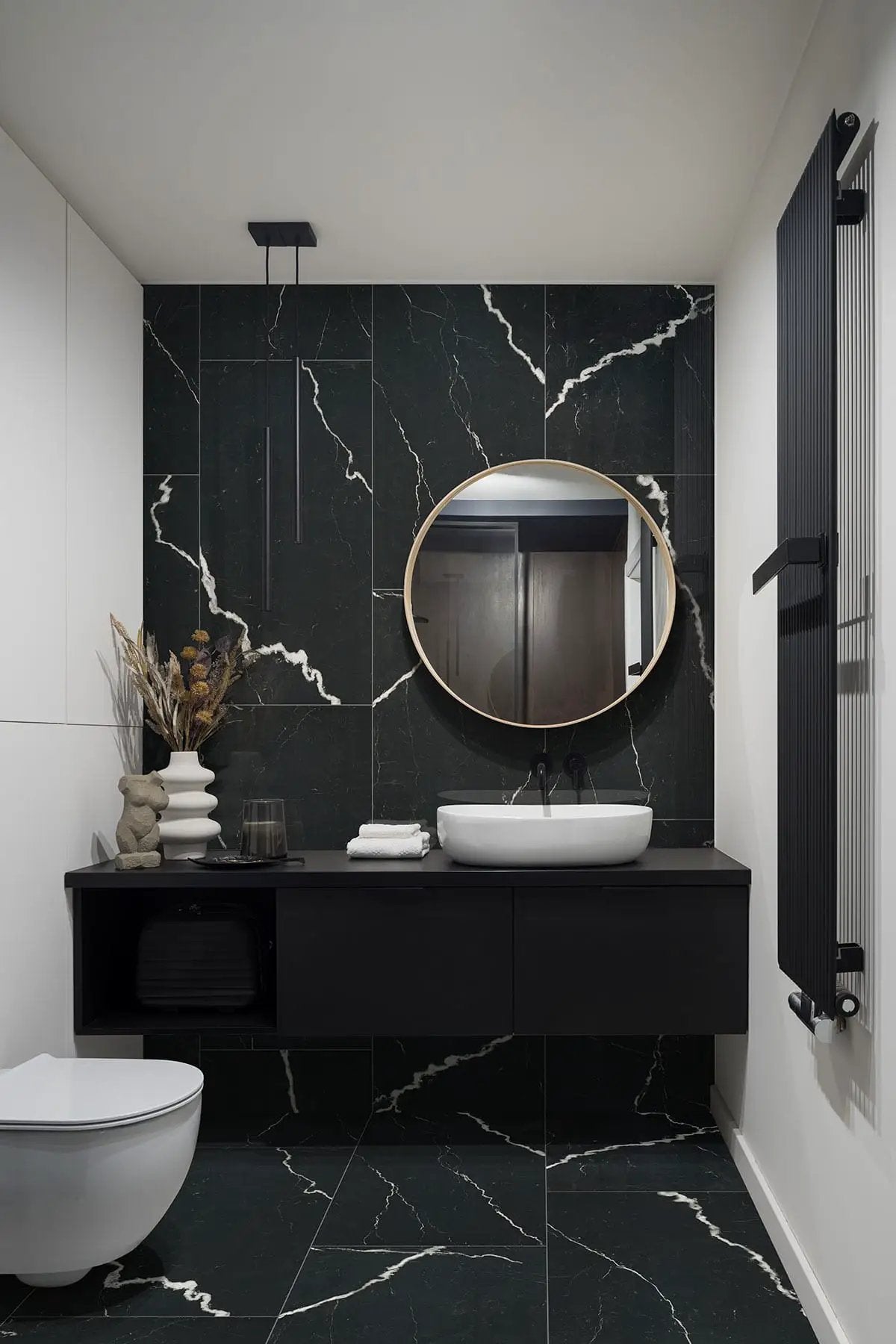 Exotika Soho Noir Polished Marble Look Porcelain Tiles 24x48 in a finished room