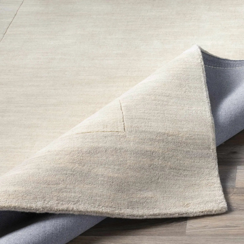 Bordered Solid Beige Cream Wool Rug by Boutique Rugs
