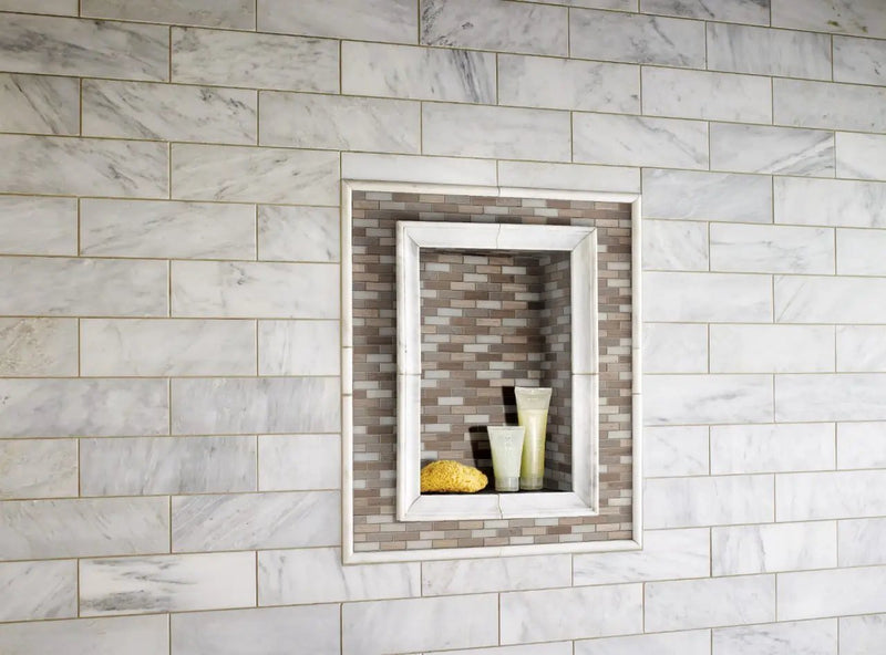 Arctic Storm 0.625x2 Brick Pattern Honed Marble Mosaics in a finished room