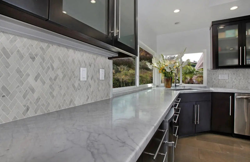 Carrara White 1x2 Herringbone Honed Marble Mosaics in a finished room