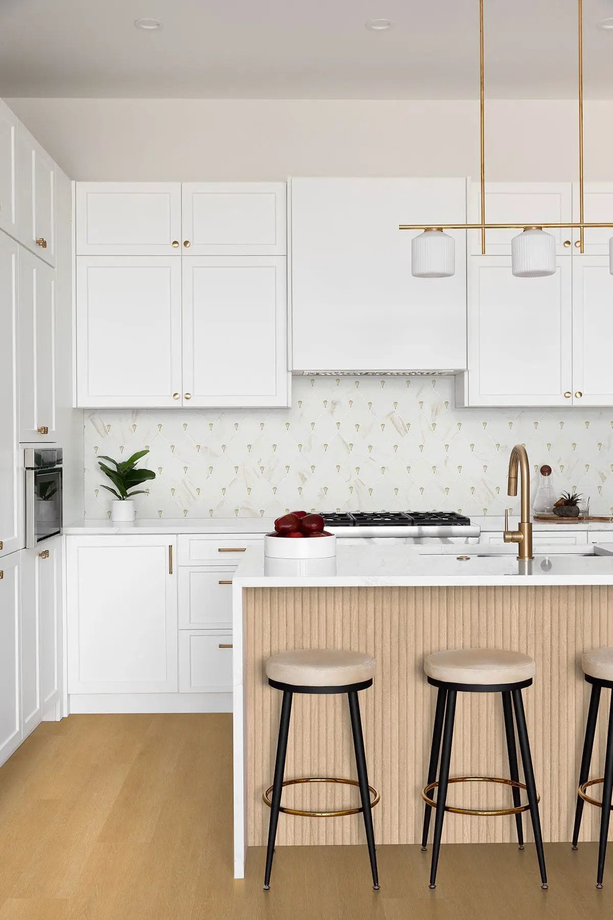 Citadel Gold Trident Tile Glossy Pattern Glass Mosaics in a finished room