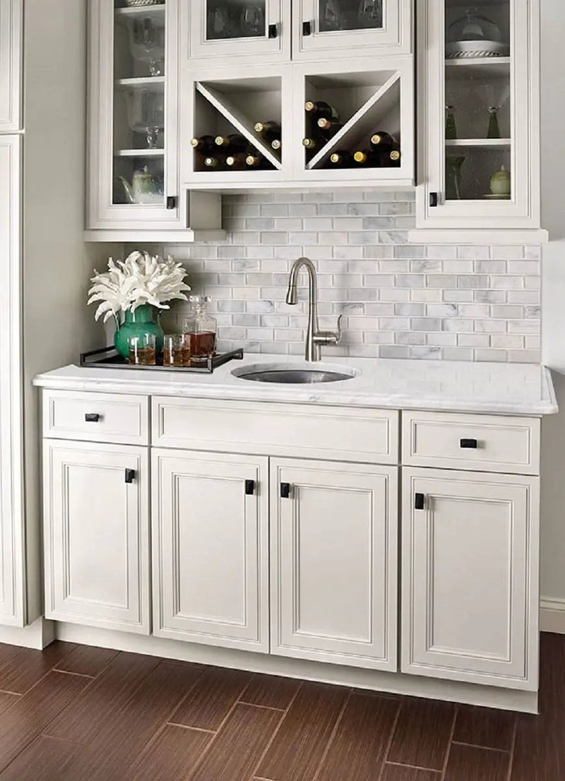 Greecian White Beveled Subway Tile 2x4 Marble Mosaics in a finished room