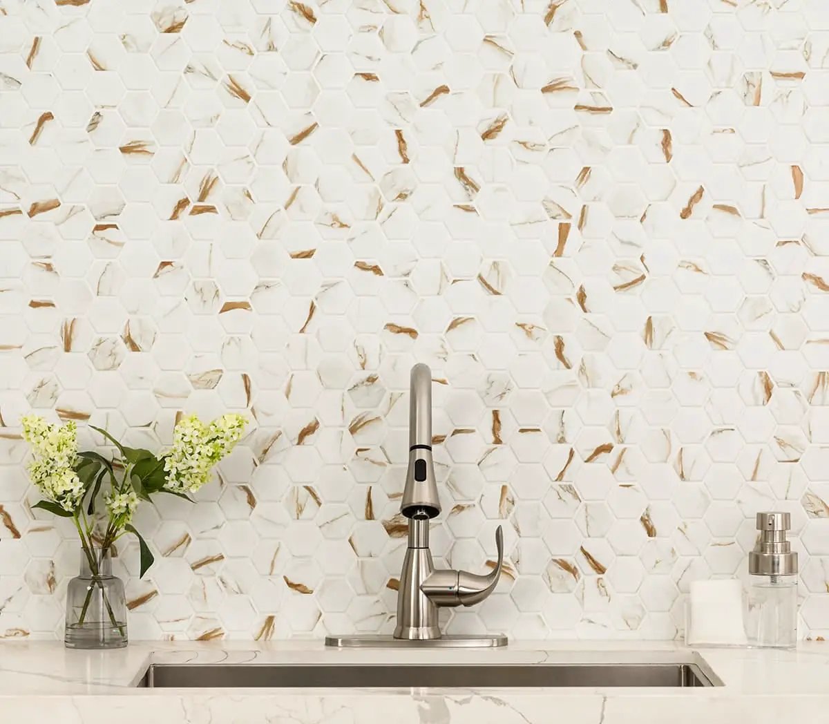 Calacatta Gold Matte 2" Hexagon Porcelain Mosaics in a finished room