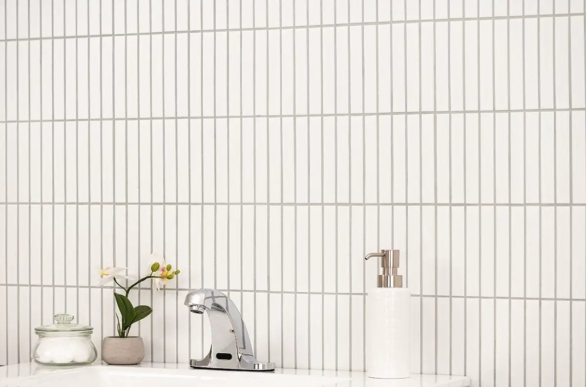 White Matte 1x6 Stack Pattern Porcelain Mosaics in a finished room