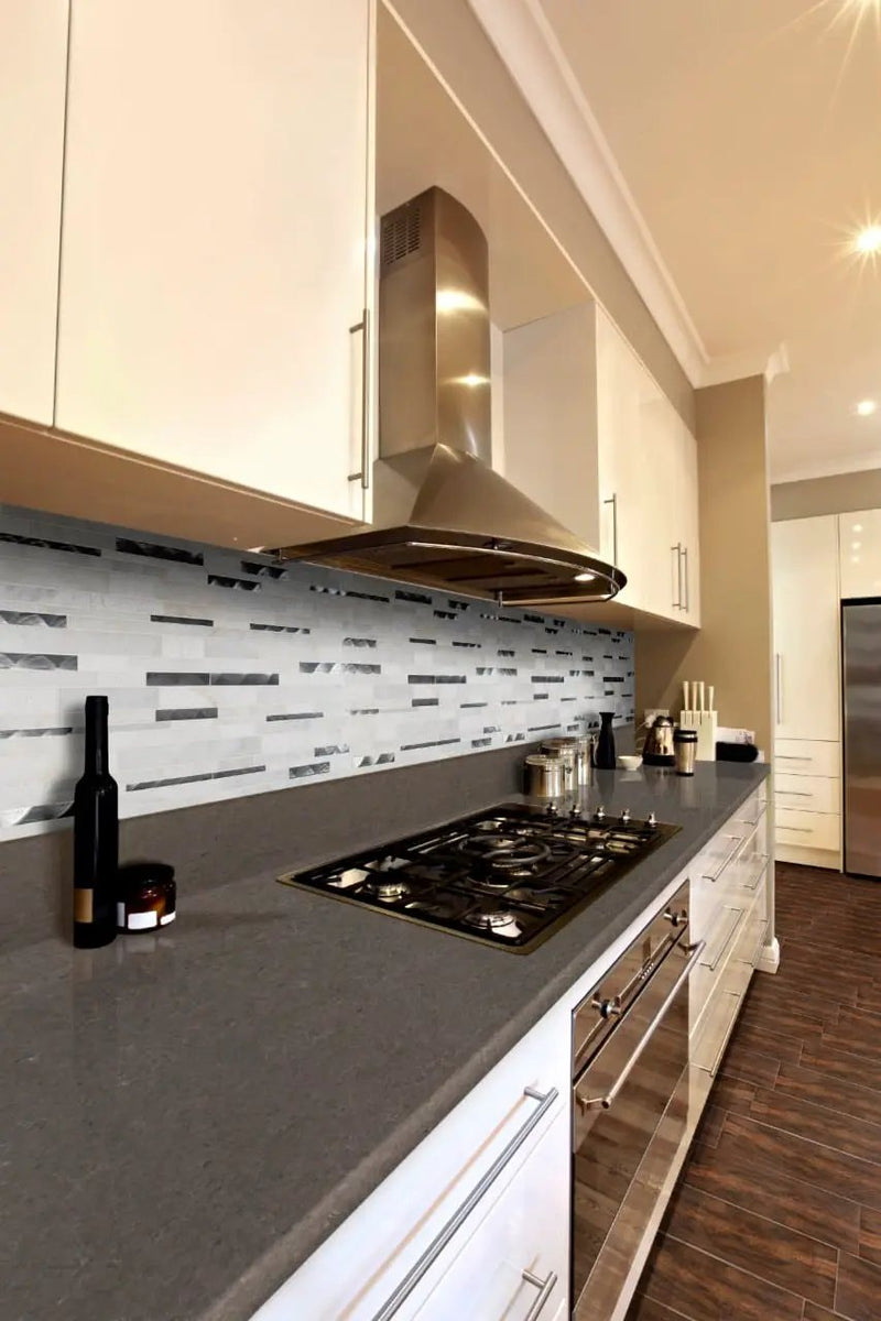 Moderno Blanco Interlocking 12x18 Pattern 8mm Metal Mosaics in a finished room