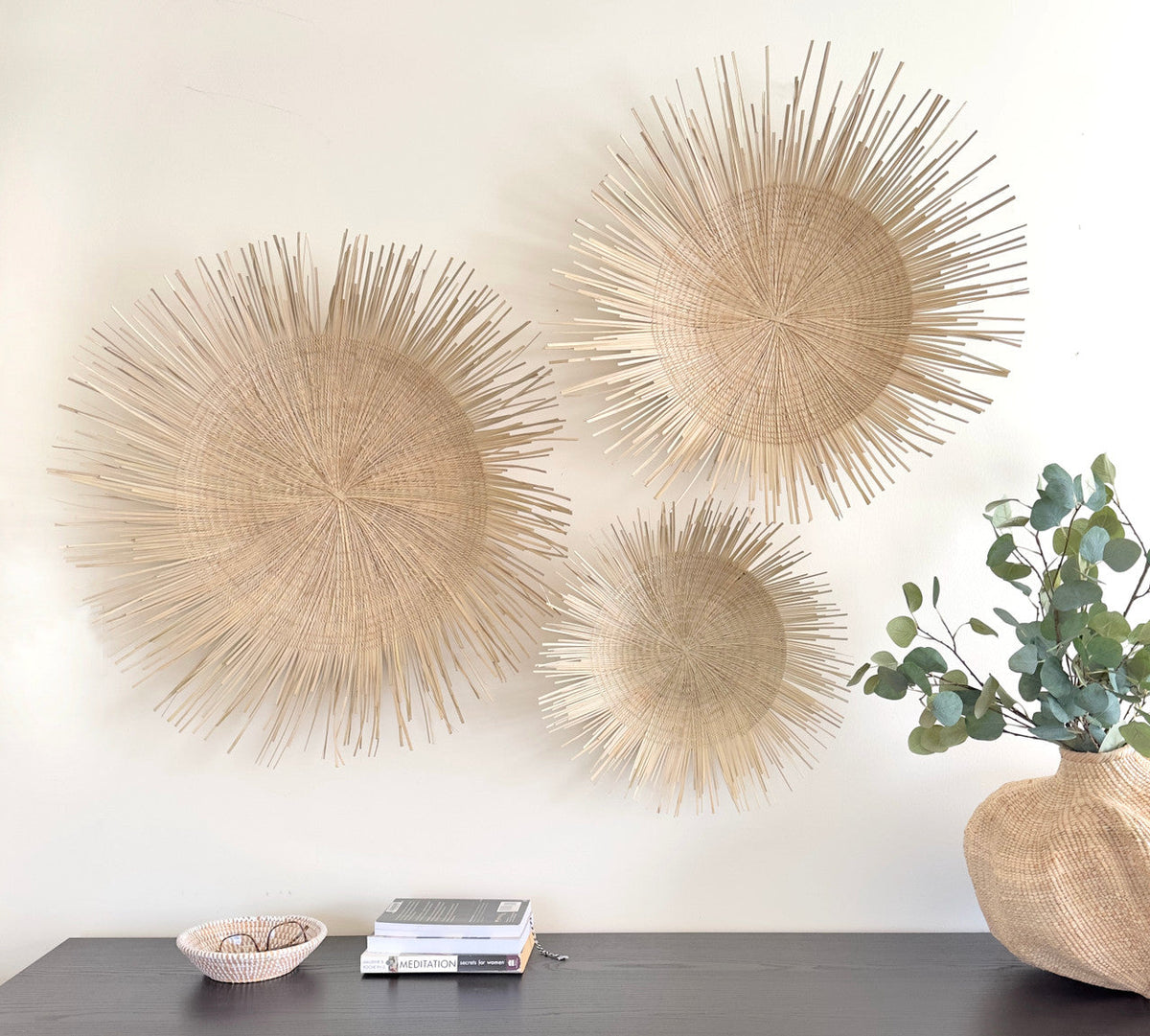 Natural Sunburst Plate Wall Hanging - 19", installed in a room