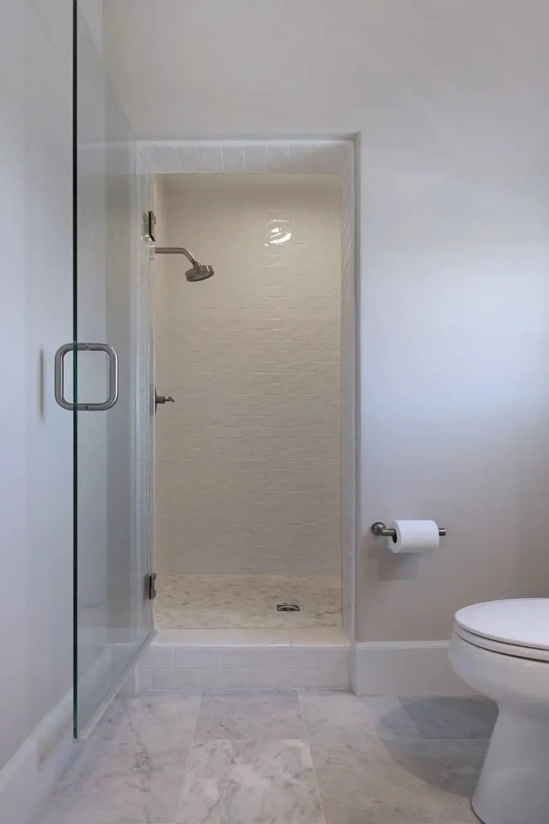 Arabescato Carrara Honed Marble Tiles 6x12 in a finished room
