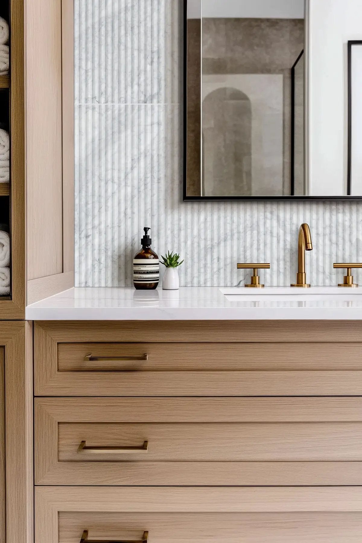 Carrara White Milano Ribbo 12x24 Honed Marble Mosaics in a finished room