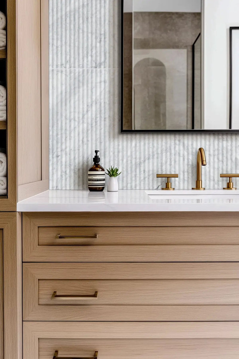 Carrara White Milano Ribbo 12x24 Honed Marble Mosaics in a finished room