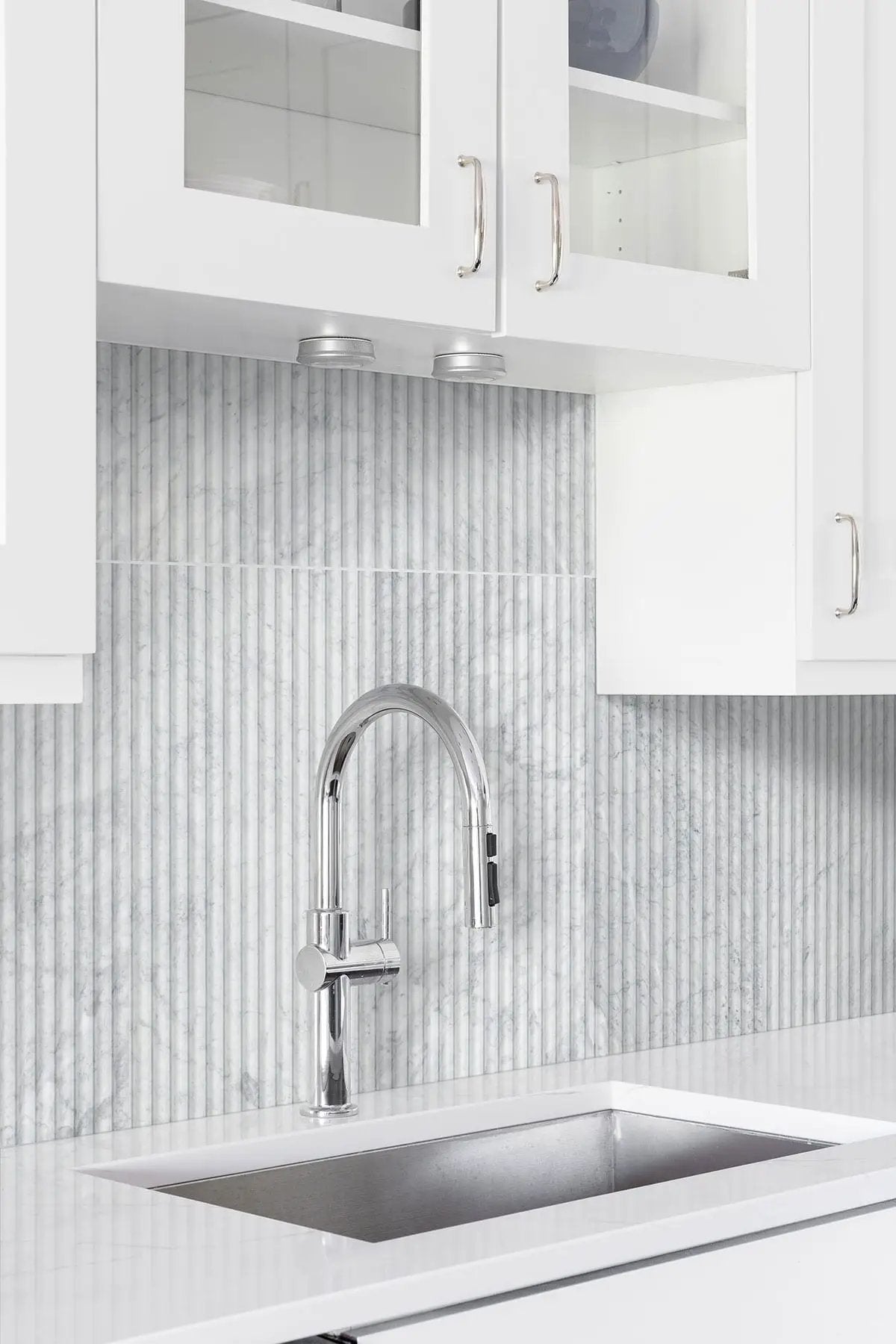 Carrara White Milano Ribbo 12x24 Honed Marble Mosaics in a finished room