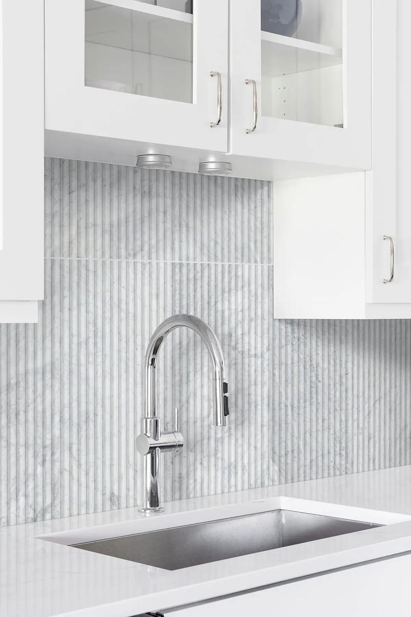 Carrara White Milano Ribbo 12x24 Honed Marble Mosaics in a finished room